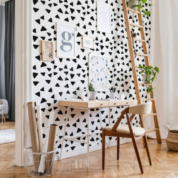 Black and white scattered triangles design pattern