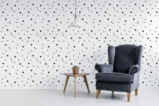 Black dots stick on wallpaper