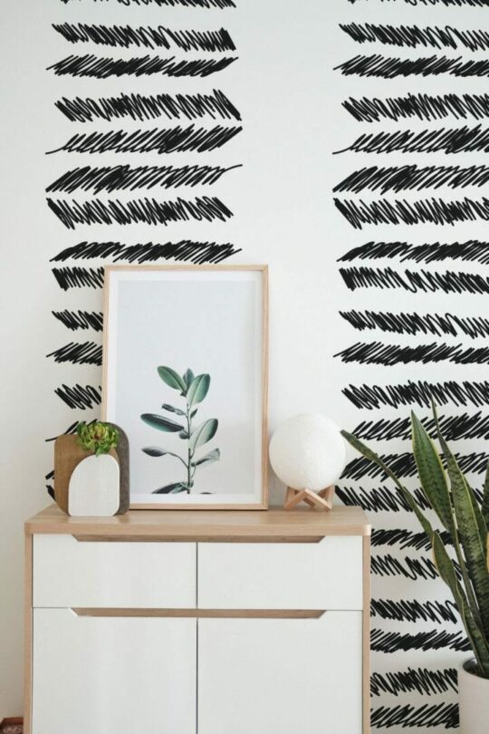 Brush stroke feather stick on wallpaper