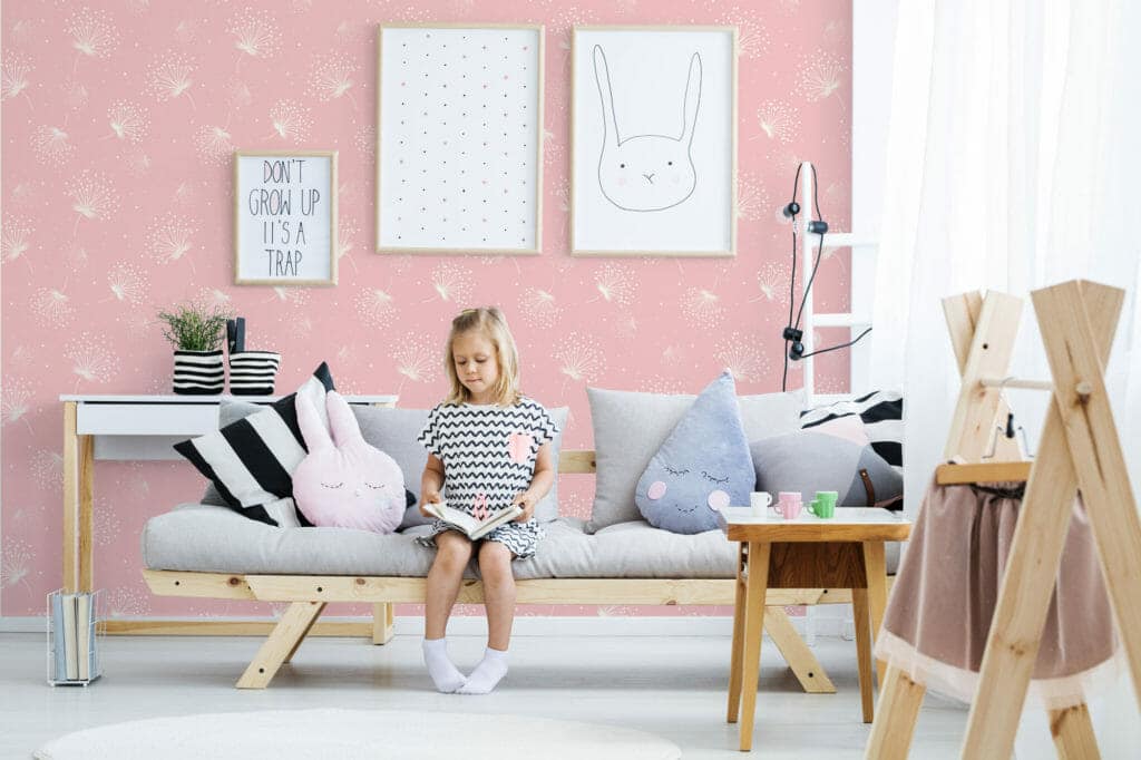 Nursery wallpaper with a pink dandelion design