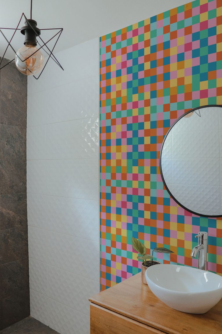Colorful, bold checkered peel and stick wallpaper installed on a bathroom wall