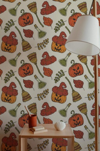 Aesthetic Halloween peel and stick wallpaper with pumpkins, witch hats, brooms, and leaves in cozy autumn-themed entryway