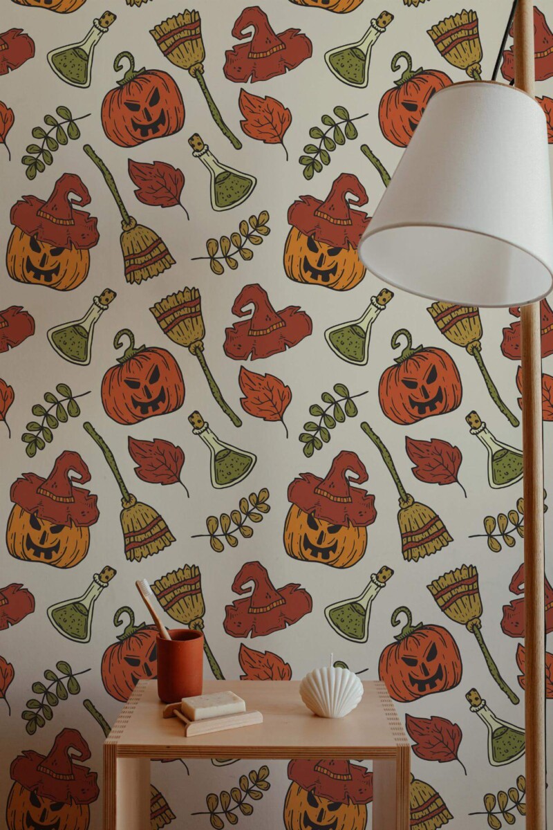 Aesthetic Halloween peel and stick wallpaper with pumpkins, witch hats, brooms, and leaves in cozy autumn-themed entryway