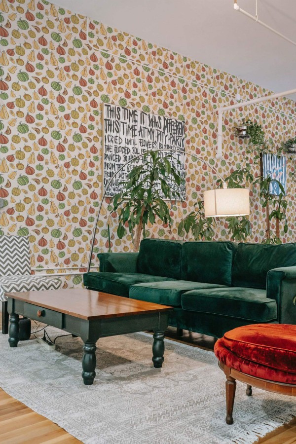 Bold eclectic style living room decorated with Aesthetic Pumpkin peel and stick wallpaper and emerald green sofa