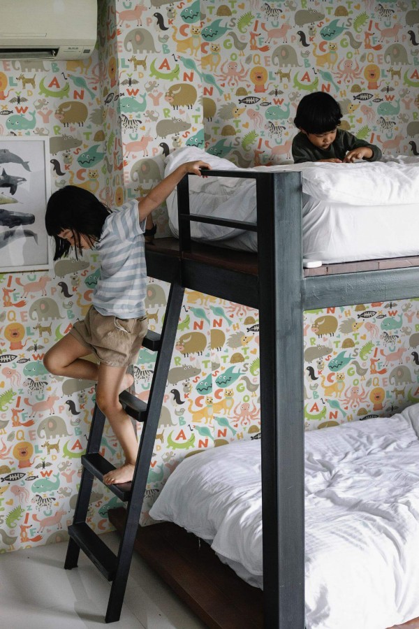 Minimalistic style kids room decorated with Animal alphabet peel and stick wallpaper