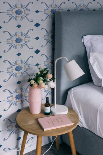 Rustic style bedroom decorated with Antique Tile peel and stick wallpaper