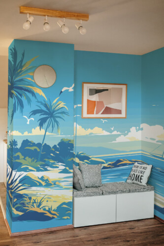Tranquil Blue Beach Landscape Wall Mural with palms, a sailboat, and sunlit blue waters, perfect for living rooms, coastal homes, or serene accent walls.