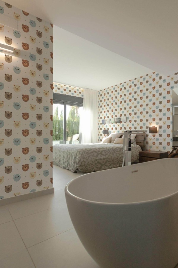 Modern style bedroom with open bathroom decorated with Bears peel and stick wallpaper