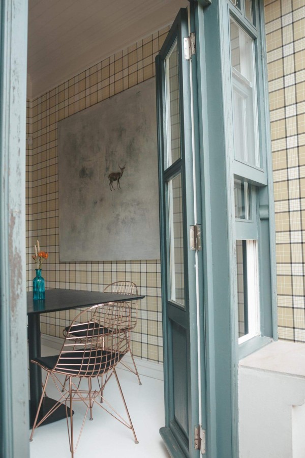 Minimal coastal style cafe decorated with Beige plaid peel and stick wallpaper