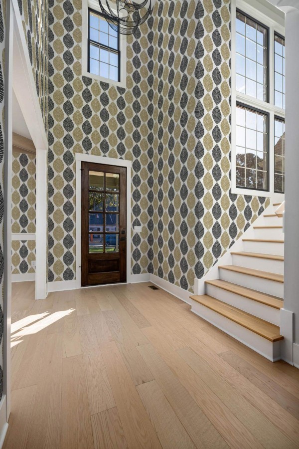 Minimal style entryway decorated with Black and beige leaf peel and stick wallpaper