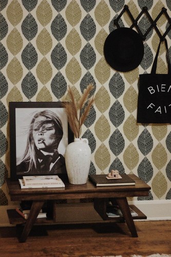 Rustic farmhouse style entryway decorated with Black and beige leaf peel and stick wallpaper