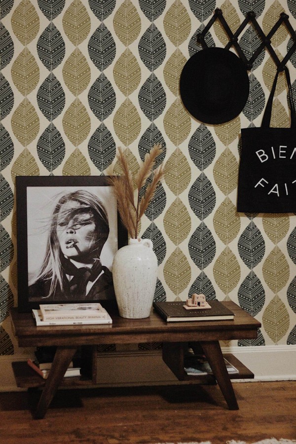 Rustic farmhouse style entryway decorated with Black and beige leaf peel and stick wallpaper