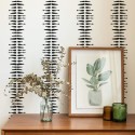Mid-century modern style living room decorated with Black and white boho stripe peel and stick wallpaper