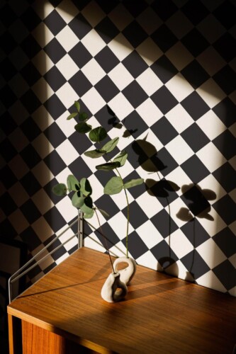 Mid-century style living room decorated with Black and white Harlequin peel and stick wallpaper