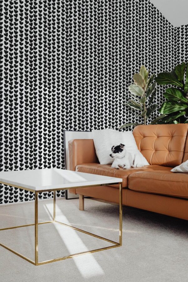 Mid-century modern style living room with dog on a sofa decorated with Black and white heart peel and stick wallpaper