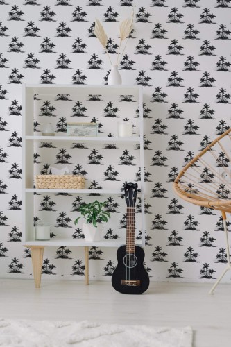 Minimal boho style living room decorated with Black and white palm peel and stick wallpaper