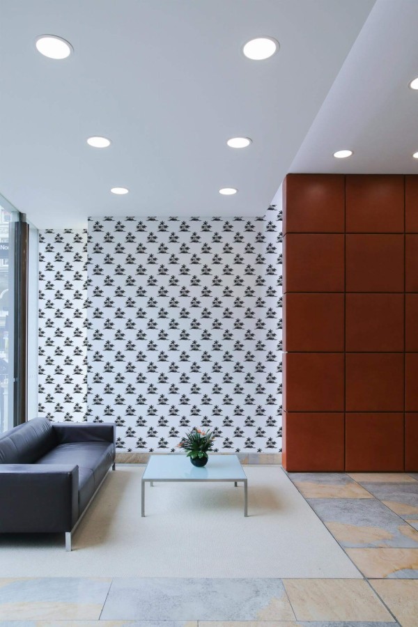 Minimal mid-century style living room decorated with Black and white palm peel and stick wallpaper