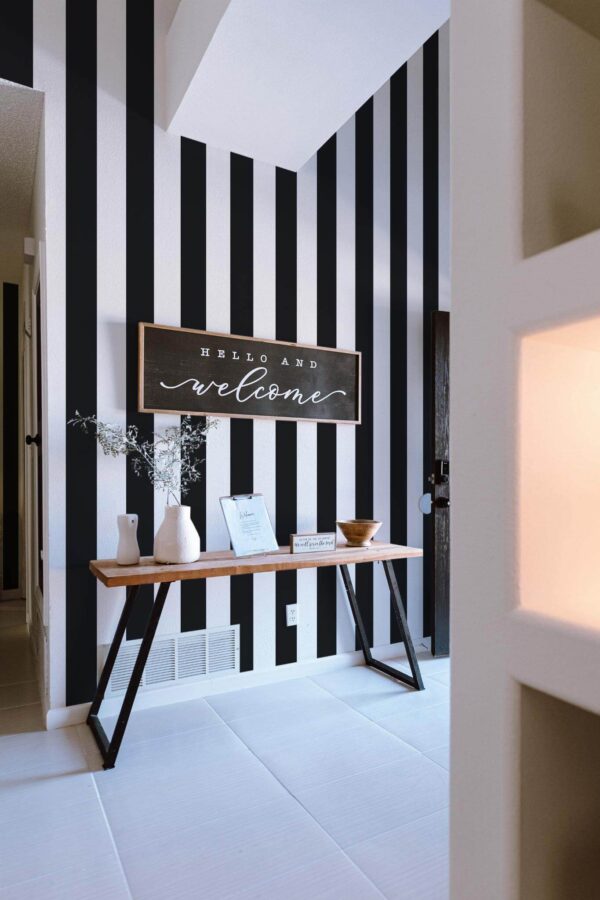Minimal farmhouse style entryway decorated with Black and white stripes peel and stick wallpaper