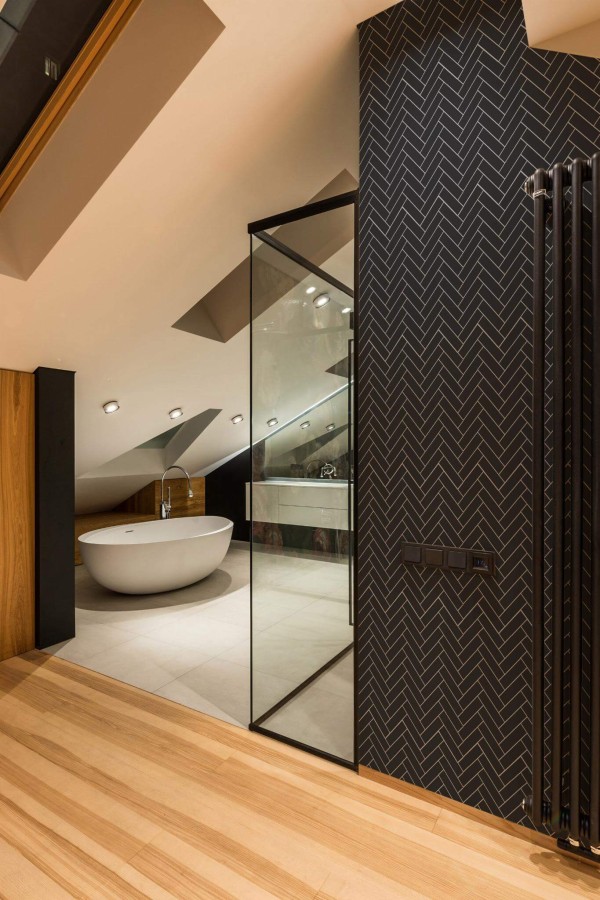 Industrial style bathroom decorated with Black herringbone peel and stick wallpaper