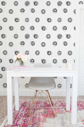 Fancy Walls peel and stick wallpaper with geometric black and white polka dots.