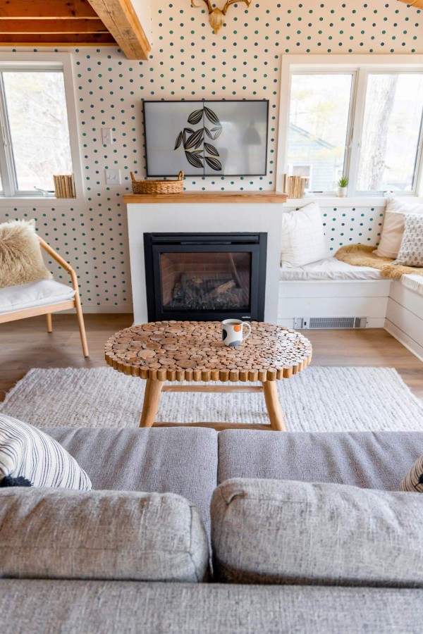 Farmhouse boho style living room decorated with Blue and teal polka dots peel and stick wallpaper