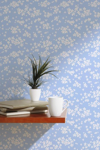 Scandinavian style accent wall decorated with Blue and white daisy peel and stick wallpaper