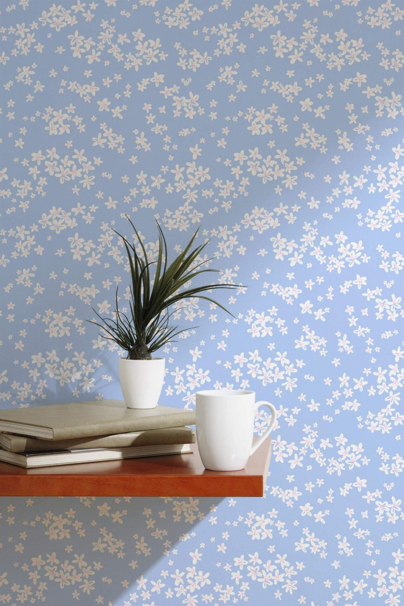 Scandinavian style accent wall decorated with Blue and white daisy peel and stick wallpaper