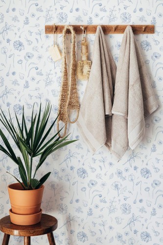 Boho style bathroom decorated with Blue and white floral peel and stick wallpaper