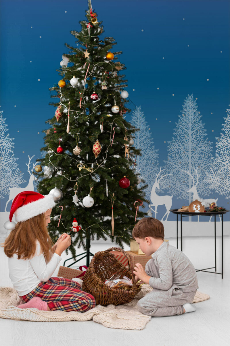 Blue and White Forest Wall Mural with snowy trees, deer, and a light blue winter background, ideal for Christmas living rooms and accent walls.