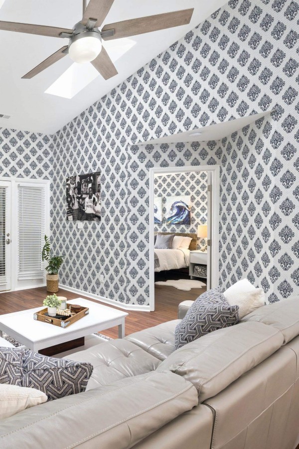 Coastal scandinavian style living room and bedroom decorated with Blue Damask peel and stick wallpaper