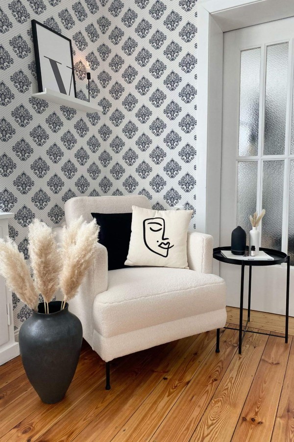 Modern boho style living room decorated with Blue Damask peel and stick wallpaper