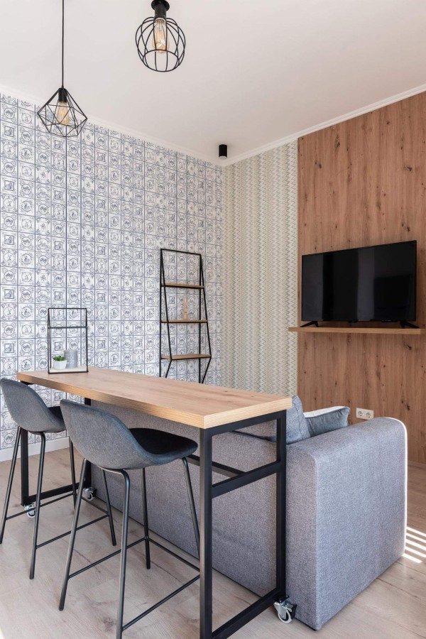 Scandinavian style open living room decorated with Blue delft tile peel and stick wallpaper
