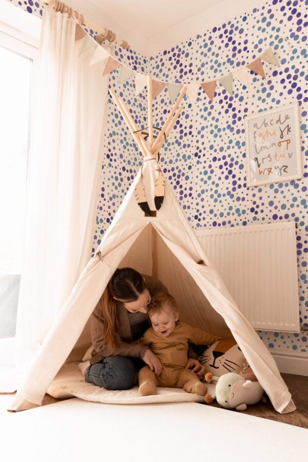 Bohemian style kids room decorated with Blue dot peel and stick wallpaper