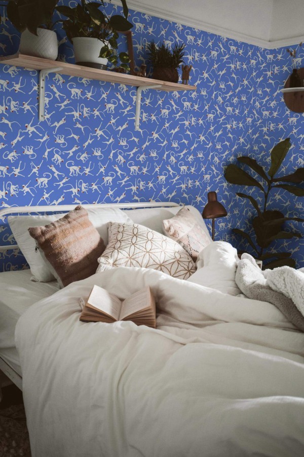 Boho style bedroom decorated with Blue monkey peel and stick wallpaper