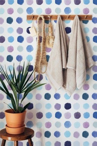 Boho style bathroom decorated with Blue watercolor dotted peel and stick wallpaper