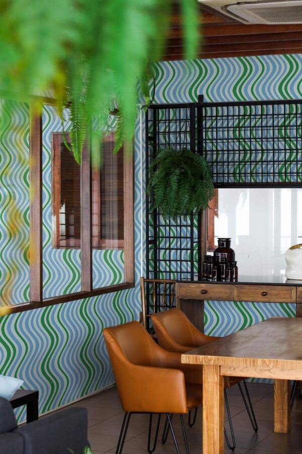 Mid-century modern style dining room decorated with Blue wavy line peel and stick wallpaper and black industrial accents