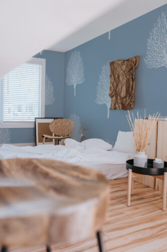 Serene Blue Arbor wall mural with blue and white minimalistic tree design, perfect for bedrooms and peaceful resting areas.