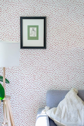 Eastern European style living room decorated with Blush dotted peel and stick wallpaper