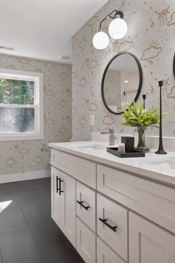 Scandinavian farmhouse style powder room decorated with Boho astrology peel and stick wallpaper