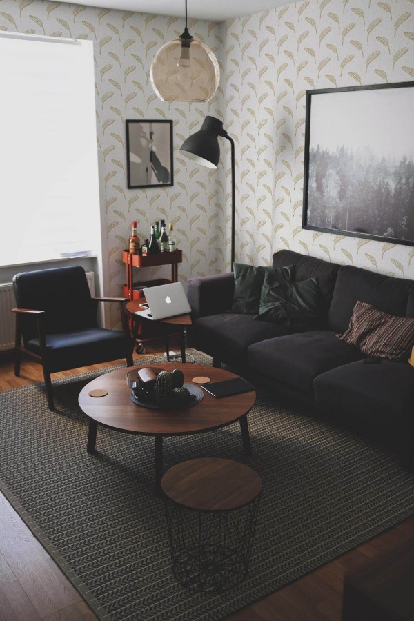 Modern dark industrial style living room decorated with Boho beige leaf peel and stick wallpaper