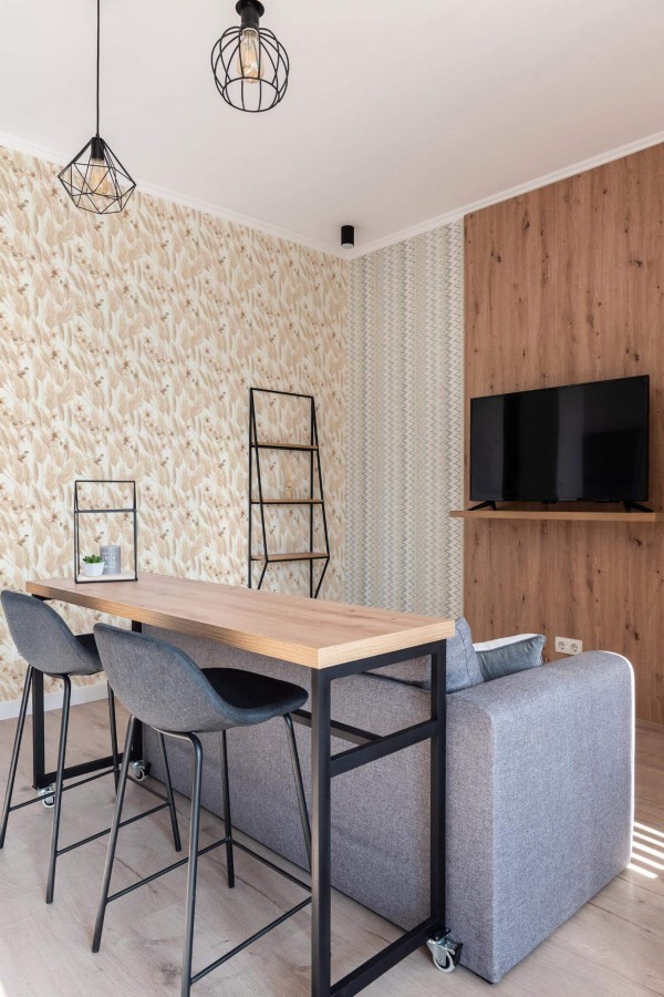 Scandinavian style open living room decorated with Boho chic peel and stick wallpaper