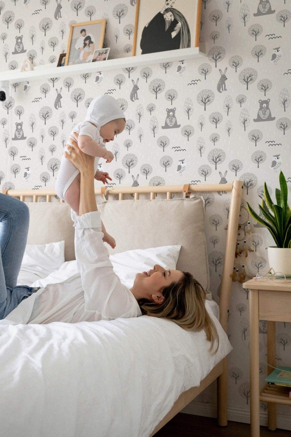 Neutral style nursery decorated with Boho forest with animals peel and stick wallpaper