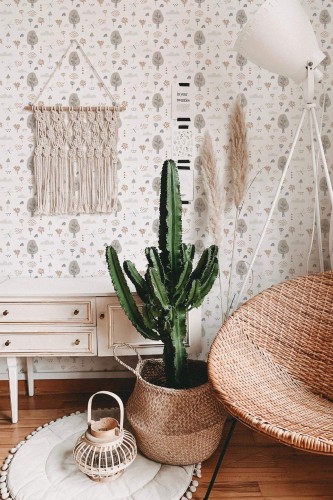 Bohemian style living room decorated with Boho neutral forest peel and stick wallpaper