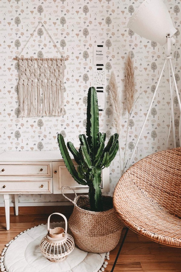 Bohemian style living room decorated with Boho neutral forest peel and stick wallpaper