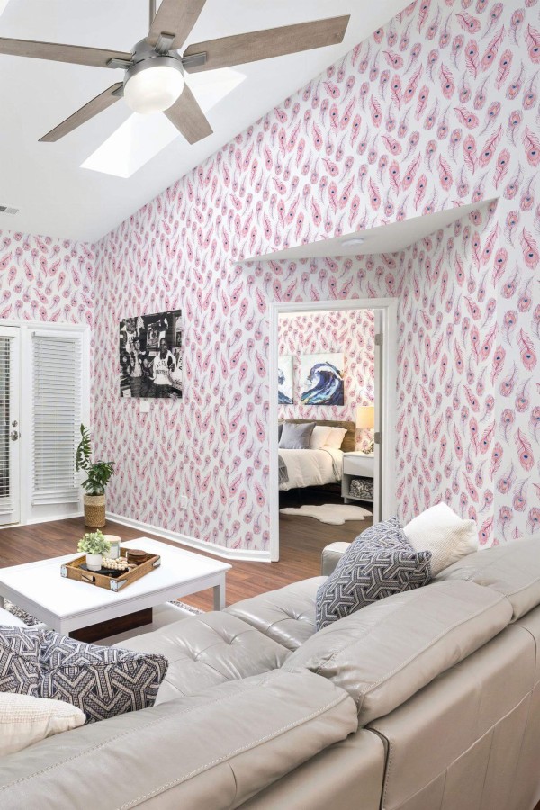 Coastal scandinavian style living room and bedroom decorated with Boho pink feather peel and stick wallpaper