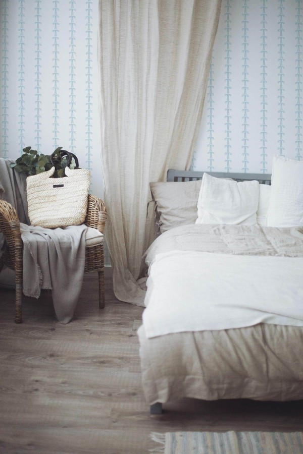 Boho style bedroom decorated with Boho tree peel and stick wallpaper