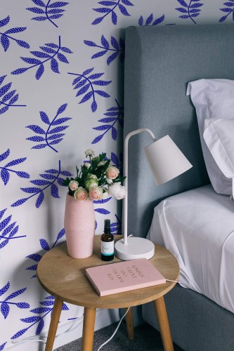 Rustic style bedroom decorated with Bold Blue leaf peel and stick wallpaper