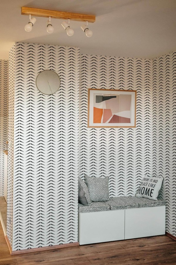 Scandinavian style entryway decorated with Bold herringbone peel and stick wallpaper