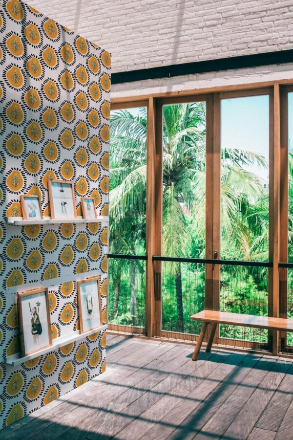 Coastal style living room decorated with Bold papaya peel and stick wallpaper