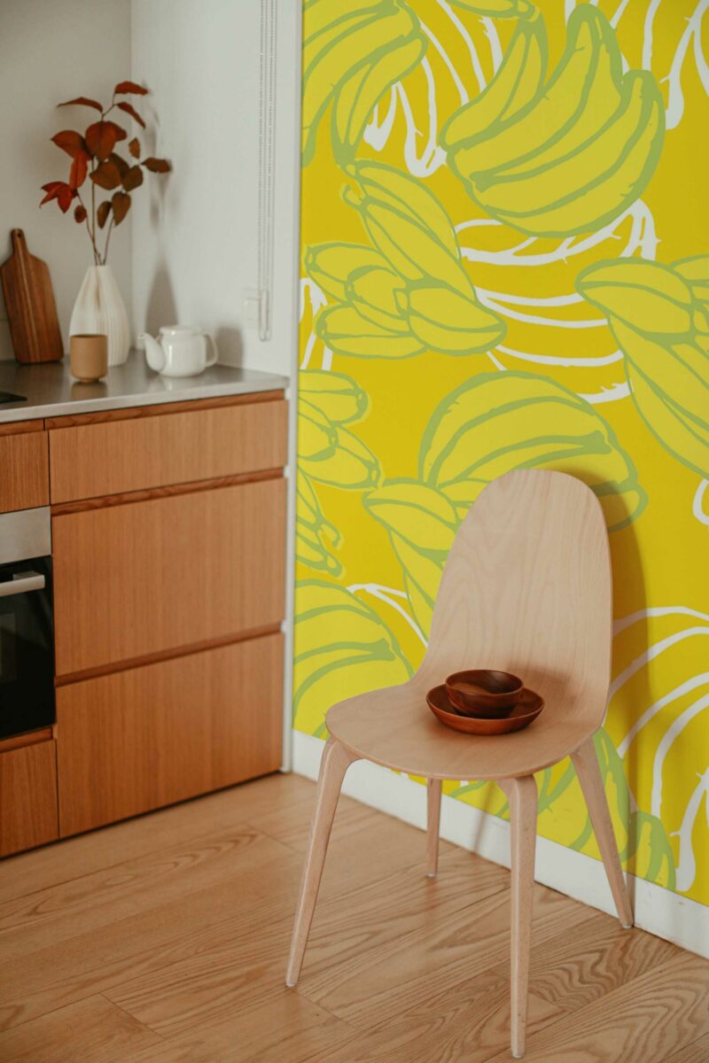 Banana Wall Mural with playful yellow banana patterns on a light background, perfect for kitchens, dining spaces, or cheerful fruit-themed accent walls.